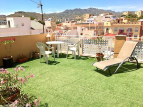 Room with single bed in typical townhouse with rooftop terrace